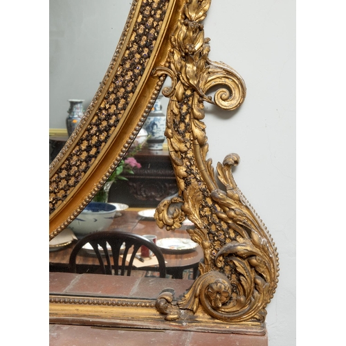 201 - A large pair of 19th century gilt gesso oval overmantel mirrors, each surmounted with a bird, a ribb... 