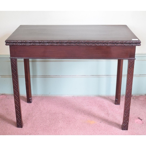 228 - A George III mahogany tea table, on blind fret carved chamfered square legs, 90.5 cm wide, removal c... 