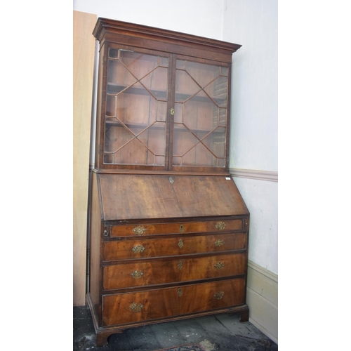 229 - A mahogany bureau bookcase, the moulded cornice above a pair of bar glazed doors, the bureau section... 