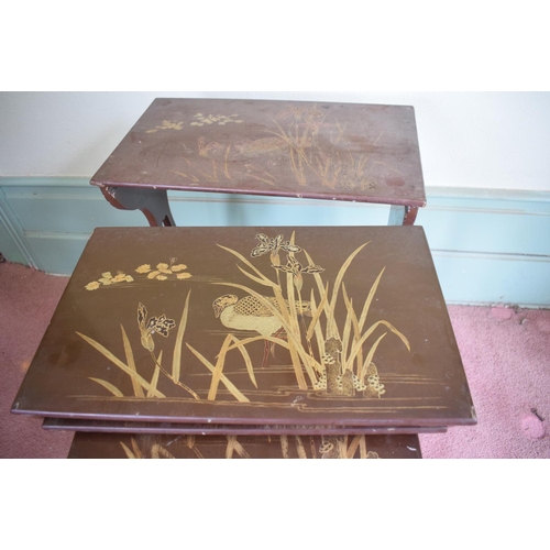 231 - A nest of four Japanese lacquered occasional tables, the largest 53 cm wide, removal cost A