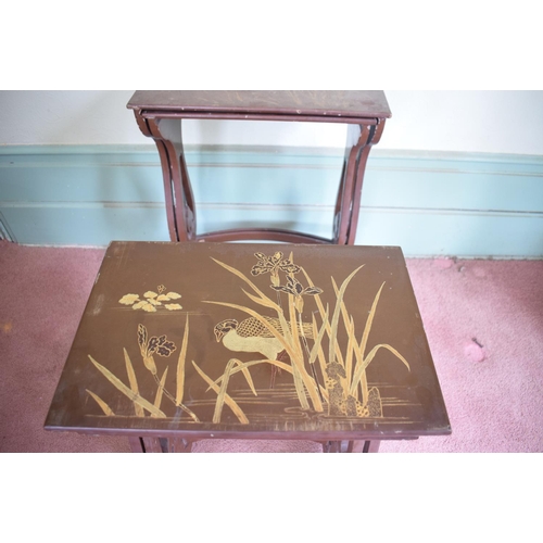 231 - A nest of four Japanese lacquered occasional tables, the largest 53 cm wide, removal cost A