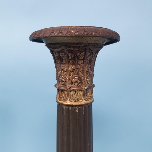 236 - A pair of bronze classical candlesticks, with fluted columns and decorated foliage, 28.5 cm high, re... 