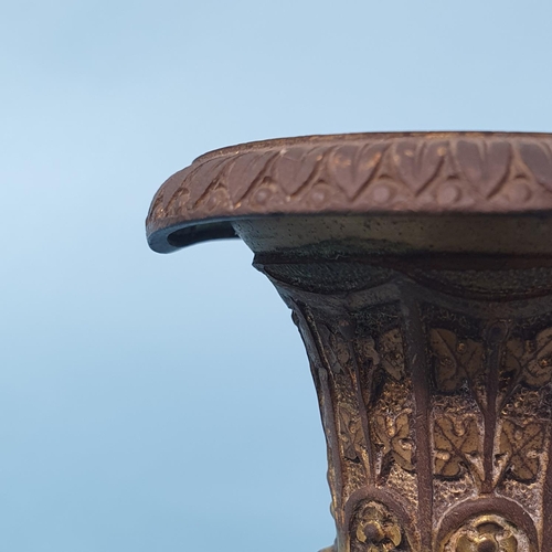 236 - A pair of bronze classical candlesticks, with fluted columns and decorated foliage, 28.5 cm high, re... 