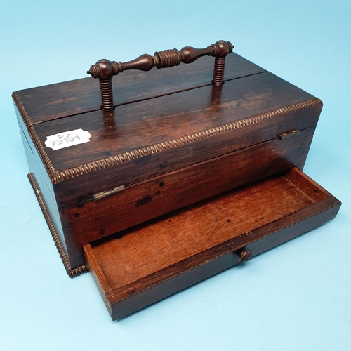 237 - A late Regency rosewood desk box, with a carrying handle, and two lid sections opening to reveal the... 