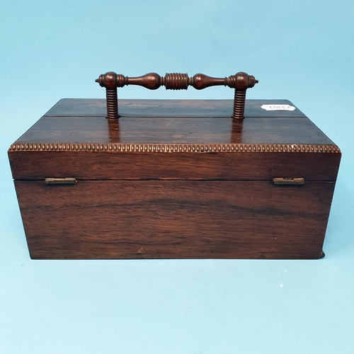 237 - A late Regency rosewood desk box, with a carrying handle, and two lid sections opening to reveal the... 