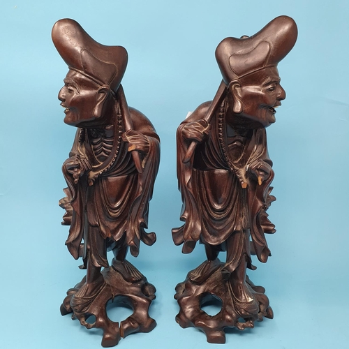 240 - A pair of Chinese root carvings, of Sages, 36.5 cm high, removal cost A