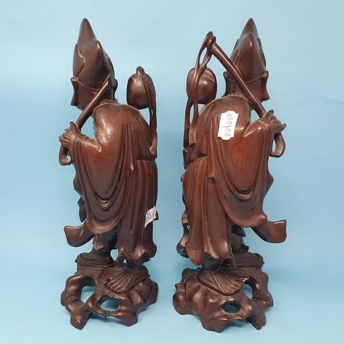 240 - A pair of Chinese root carvings, of Sages, 36.5 cm high, removal cost A