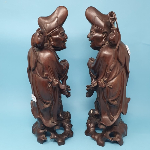 240 - A pair of Chinese root carvings, of Sages, 36.5 cm high, removal cost A