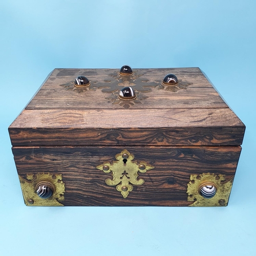 243 - A Victorian coromandel wood jewellery casket, the brass mounts set banded agates, faded, 26 cm wide,... 