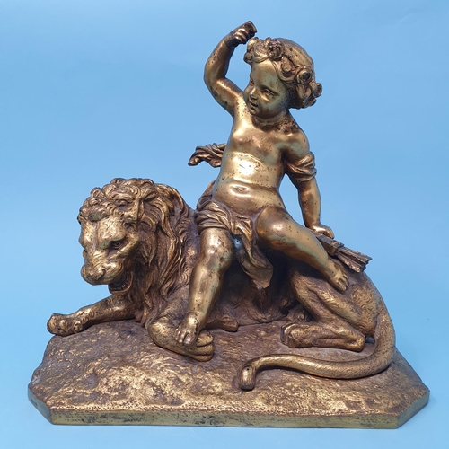 244 - A pair of ormolu groups, with cherubs seated upon a lion and lioness, one cherub wing detached, 22 c... 