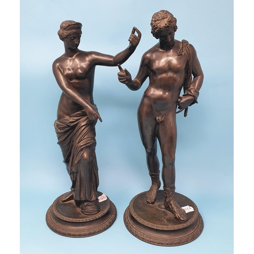 245 - A pair of Grand Tour bronze figures, of a classical scantily clad lady and her companion, 37 cm high... 