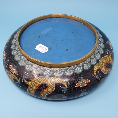 251 - A Chinese cloisonne bowl, decorated a dragon chasing a flaming pearl, 30 cm diameter, removal cost A