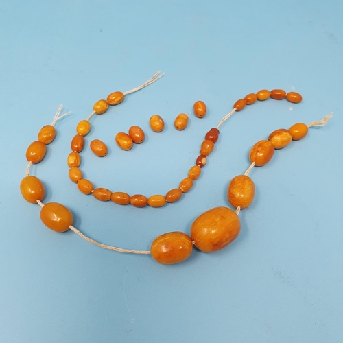 253 - A group of amber beads, removal cost A