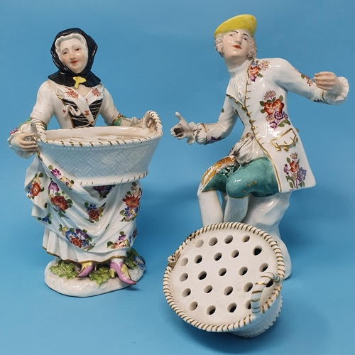 256 - A pair of 19th century Dresden figures, man and a woman holding baskets, 29 cm high, removal cost A