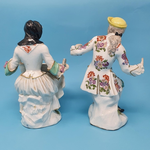 256 - A pair of 19th century Dresden figures, man and a woman holding baskets, 29 cm high, removal cost A