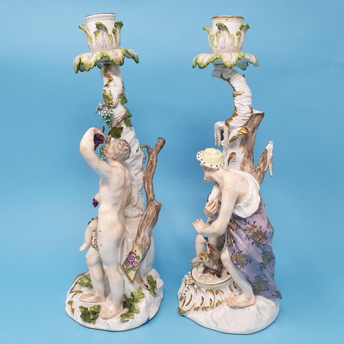 258 - A pair of Dresden candlesticks, autumn and winter, figural bases, 30 cm high, removal cost A