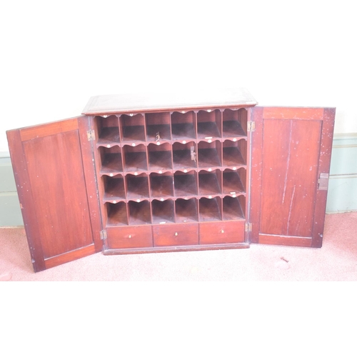 261 - A 19th century mahogany cabinet, having a pair of doors enclosing pigeon holes named A-Z, and with t... 