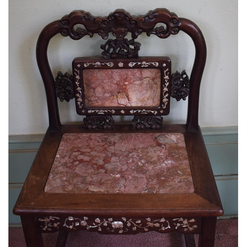 275 - A Chinese hardwood chair, inlaid with mother of pearl, with carved and pierced decoration, the back ... 