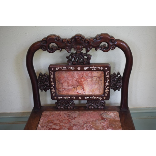 275 - A Chinese hardwood chair, inlaid with mother of pearl, with carved and pierced decoration, the back ... 