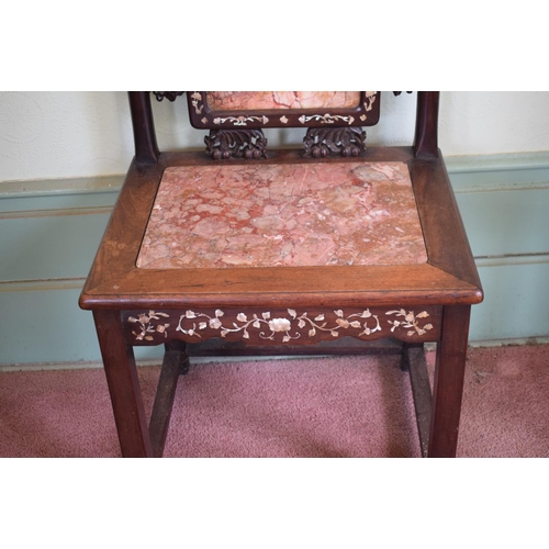 275 - A Chinese hardwood chair, inlaid with mother of pearl, with carved and pierced decoration, the back ... 