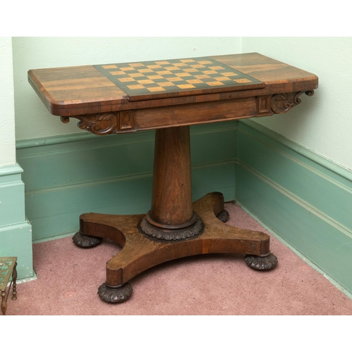 276 - An early Victorian rosewood games table, with reversible central section, on a tapering column, with... 