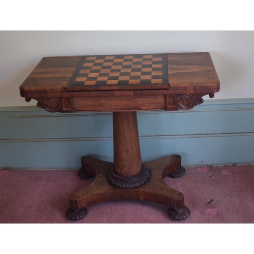 276 - An early Victorian rosewood games table, with reversible central section, on a tapering column, with... 