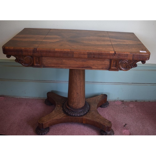 276 - An early Victorian rosewood games table, with reversible central section, on a tapering column, with... 