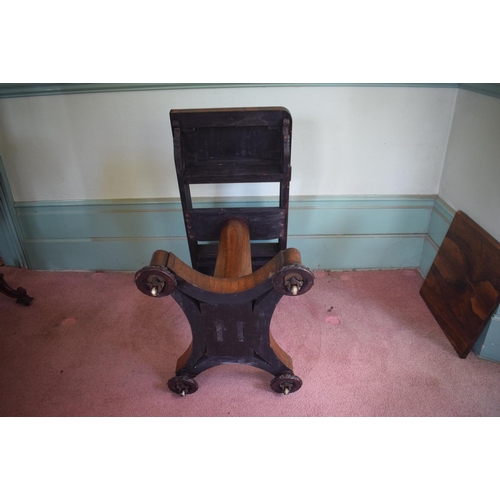 276 - An early Victorian rosewood games table, with reversible central section, on a tapering column, with... 