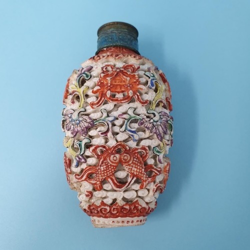 286 - A Chinese carved hardstone snuff bottle, decorated fish, vases and sprigs, character mark to base, 7... 