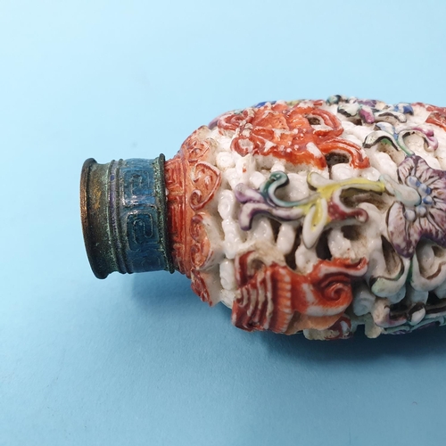 286 - A Chinese carved hardstone snuff bottle, decorated fish, vases and sprigs, character mark to base, 7... 