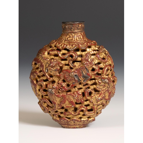 287 - A Chinese lacquered snuff bottle, decorated Dogs of Fo and mythical beasts, 7 cm high