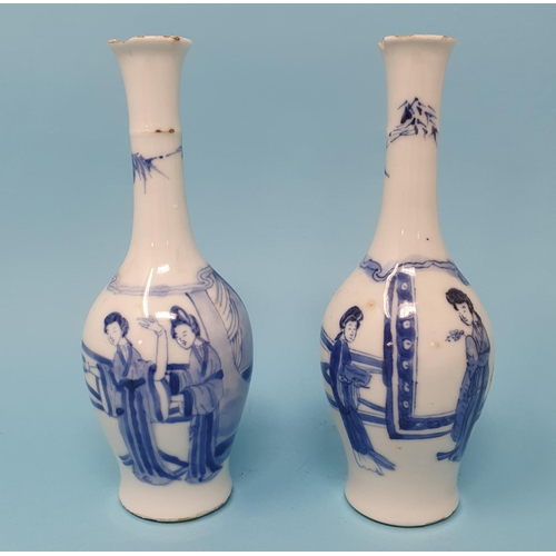 296 - A pair of Chinese blue and white vases, decorated figures, 16 cm high, removal charge A