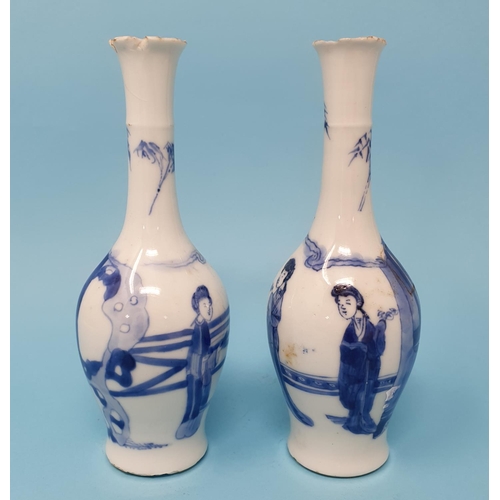 296 - A pair of Chinese blue and white vases, decorated figures, 16 cm high, removal charge A