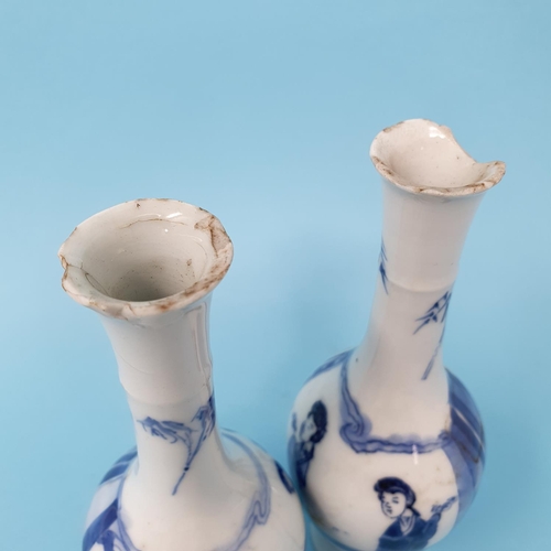 296 - A pair of Chinese blue and white vases, decorated figures, 16 cm high, removal charge A