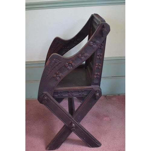 30 - A Glastonbury carved oak armchair, removal cost B