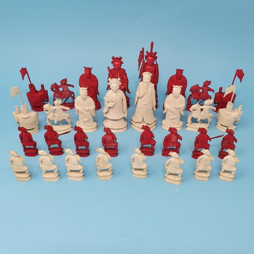 300 - An early 20th century Chinese carved and stained ivory chess set, the King 10 cm, removal cost A