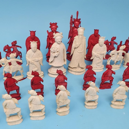 300 - An early 20th century Chinese carved and stained ivory chess set, the King 10 cm, removal cost A