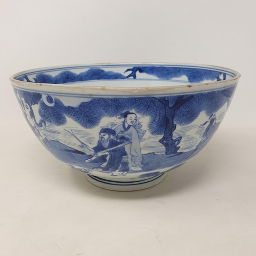 301 - A Chinese bowl, decorated figures in underglaze blue, six character mark to base, 21 cm diameter, re... 