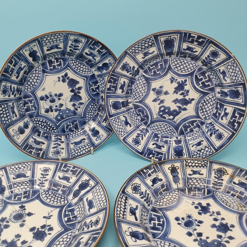 308 - A set of four Chinese plates, decorated flowers in underglaze blue, 21 cm diameter, removal cost A