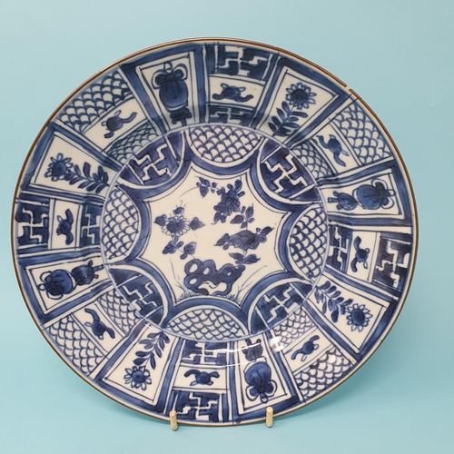 308 - A set of four Chinese plates, decorated flowers in underglaze blue, 21 cm diameter, removal cost A