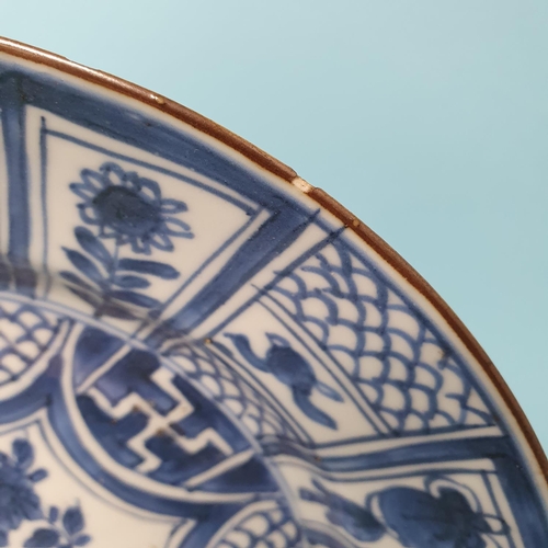 308 - A set of four Chinese plates, decorated flowers in underglaze blue, 21 cm diameter, removal cost A