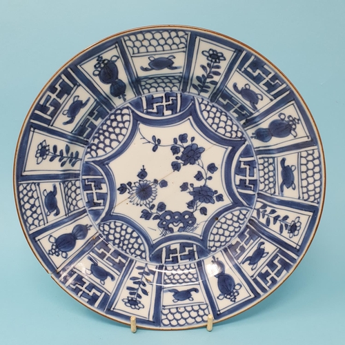 308 - A set of four Chinese plates, decorated flowers in underglaze blue, 21 cm diameter, removal cost A