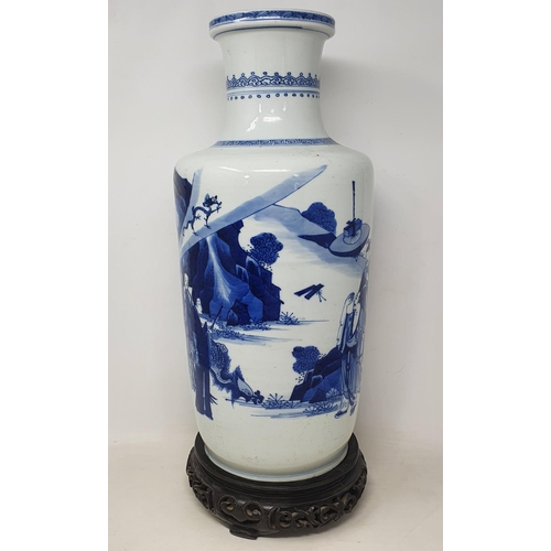 309 - A Chinese rouleau vase, decorated a man breathing fire with a dragon and other figures in underglaze... 