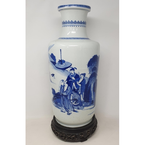 309 - A Chinese rouleau vase, decorated a man breathing fire with a dragon and other figures in underglaze... 