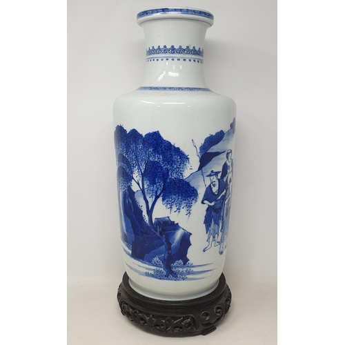 309 - A Chinese rouleau vase, decorated a man breathing fire with a dragon and other figures in underglaze... 