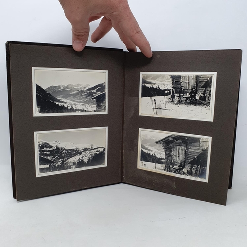 338 - A photograph and scrap album, Lenk and other winter pastimes