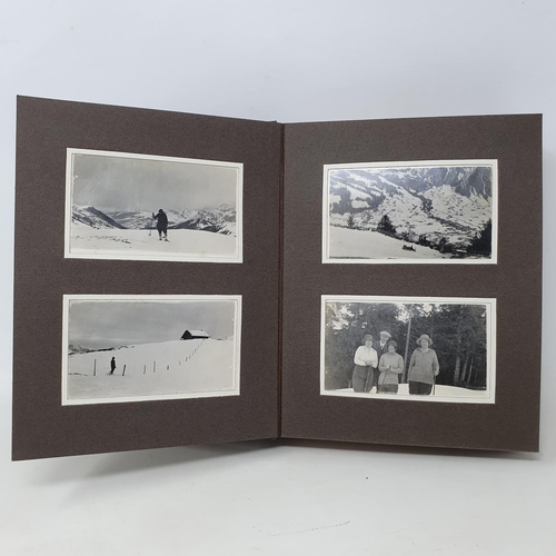 338 - A photograph and scrap album, Lenk and other winter pastimes