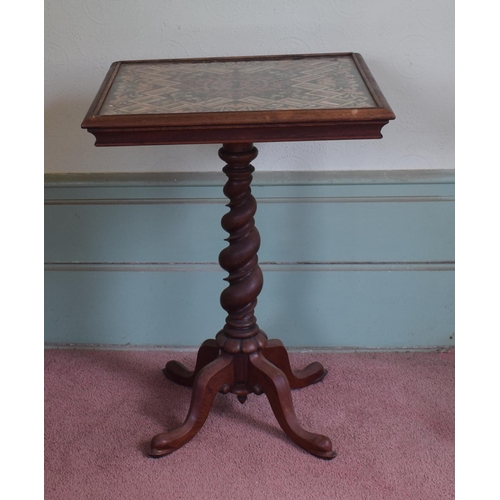 343 - A rosewood occasional table, the top inset a needlework panel, on a barley twist column, 53 cm wide,... 