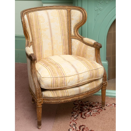 344 - A Louis XVI style carved giltwood armchair, with acanthus leaf decoration, on tapering fluted legs, ... 