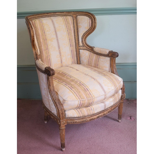 344 - A Louis XVI style carved giltwood armchair, with acanthus leaf decoration, on tapering fluted legs, ... 